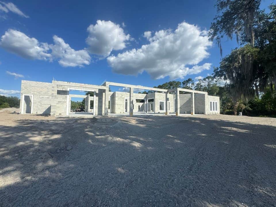 Large block shell with tie-beam columns, dramatic sky | concrete and foundation work in North Port, FL by Sosnin Builders
