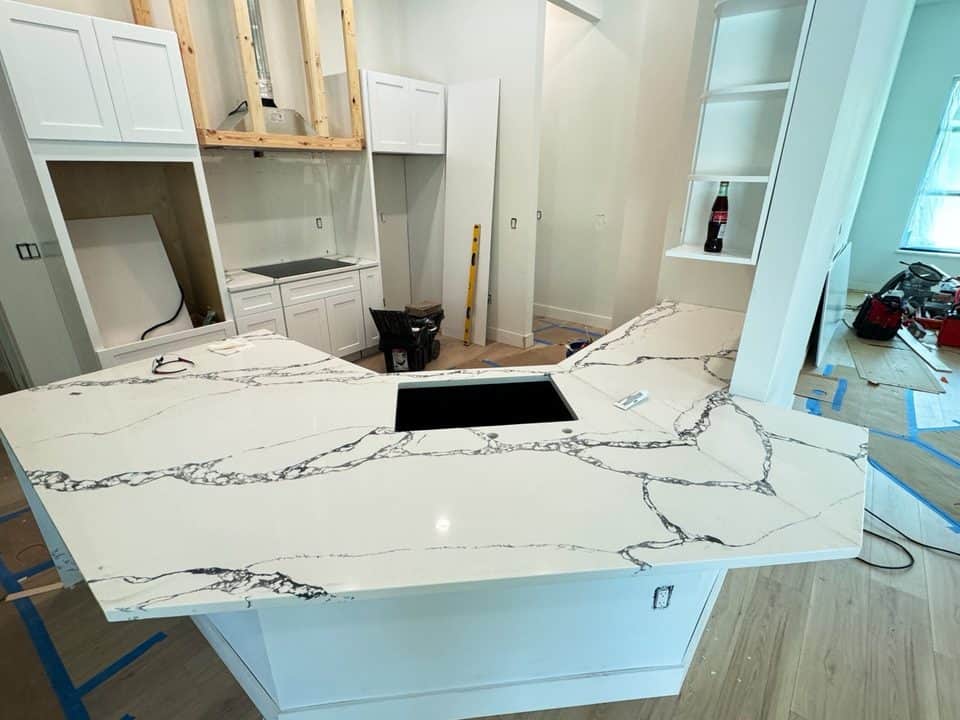 Calacatta quartz island install, kitchen build | construction work in progress in Port Charlotte, FL by Sosnin Builders
