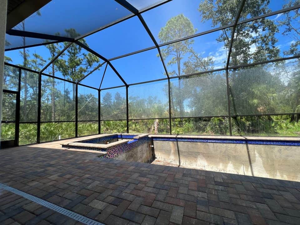 Screen enclosure over pool under construction | screen enclosure work in Port Charlotte, FL by Sosnin Builders