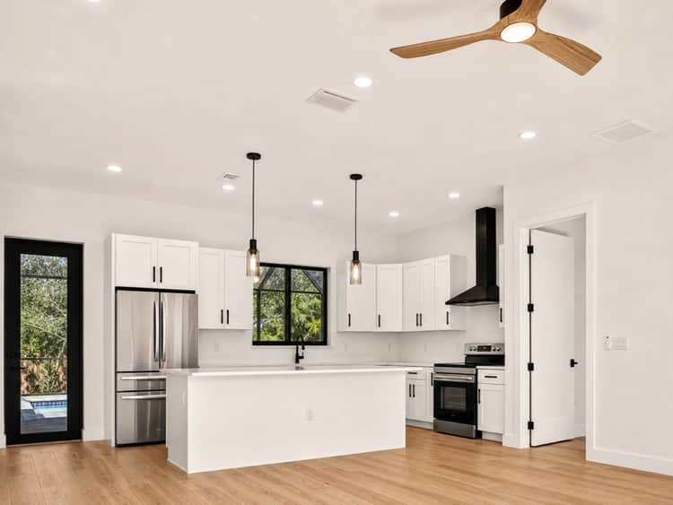 Renovated open-plan kitchen by Sosnin Builders