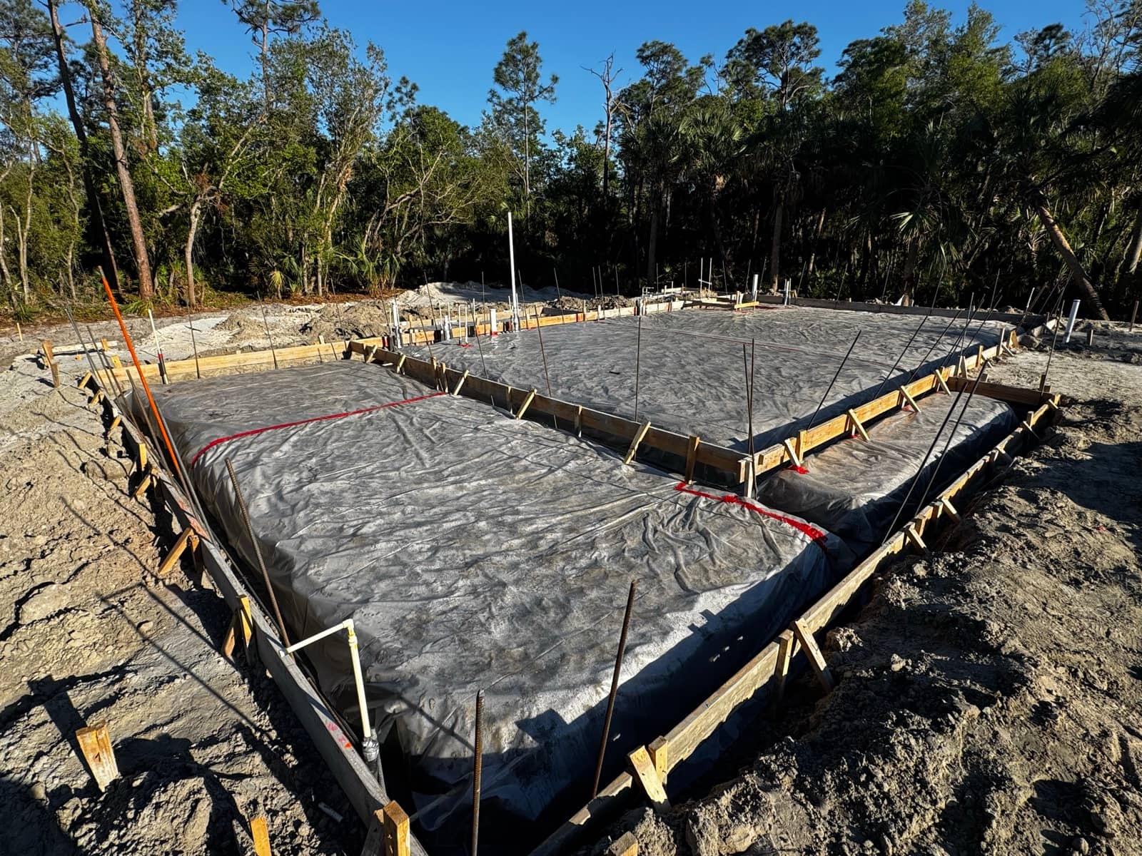 Formed slab with vapor barrier, golden hour | concrete and foundation work in North Port, FL by Sosnin Builders