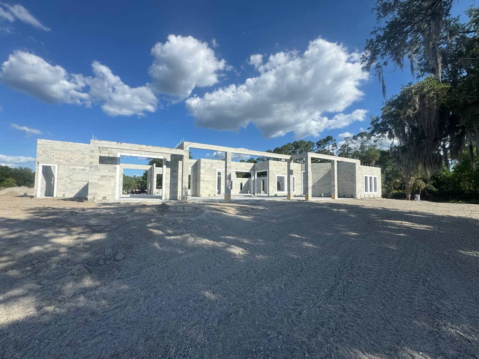 Large block shell with tie-beam columns, dramatic sky | concrete and foundation work in North Port, FL by Sosnin Builders