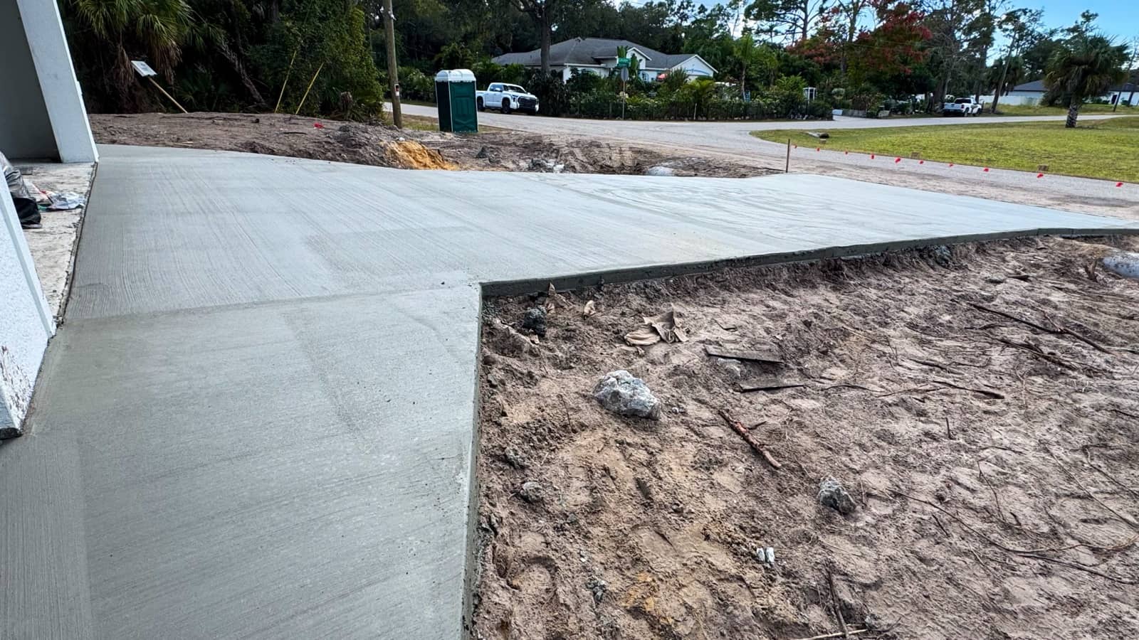 Freshly finished concrete driveway pour | concrete and foundation work in Port Charlotte, FL by Sosnin Builders