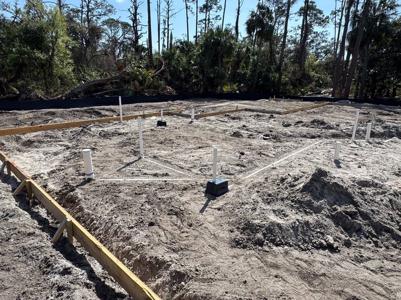 Foundation pad with plumbing rough-in | concrete and foundation work in Port Charlotte, FL by Sosnin Builders