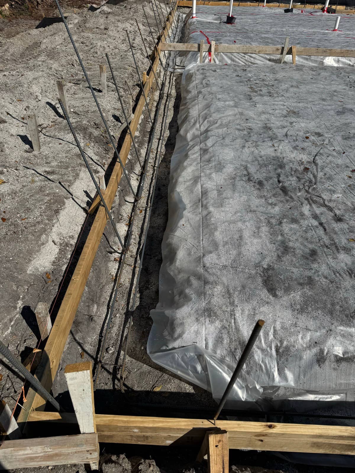 Footer forms rebar and vapor barrier | concrete and foundation work in Port Charlotte, FL by Sosnin Builders