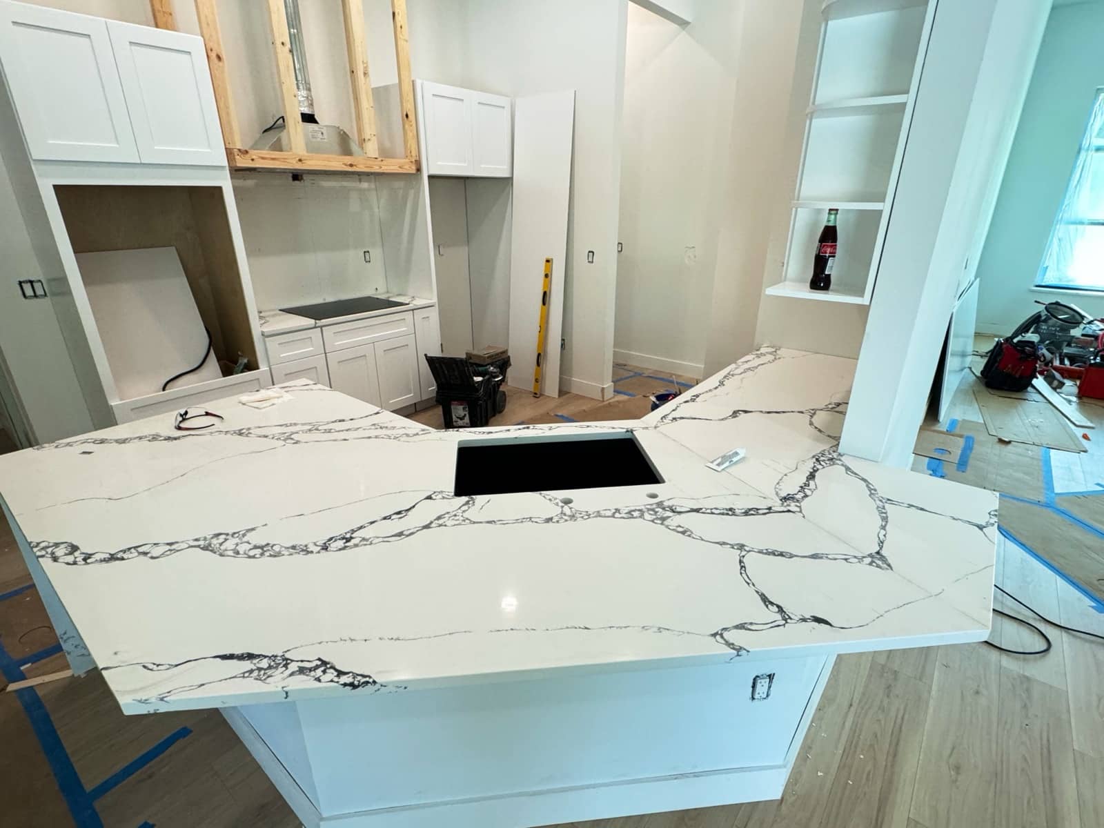 Calacatta quartz island install, kitchen build | construction work in progress in Port Charlotte, FL by Sosnin Builders