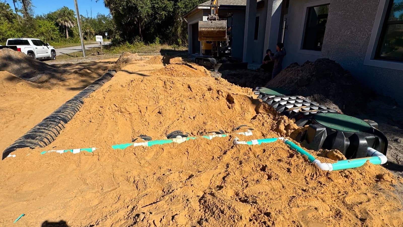 Septic system piping install, site work | construction work in progress in Port Charlotte, FL by Sosnin Builders