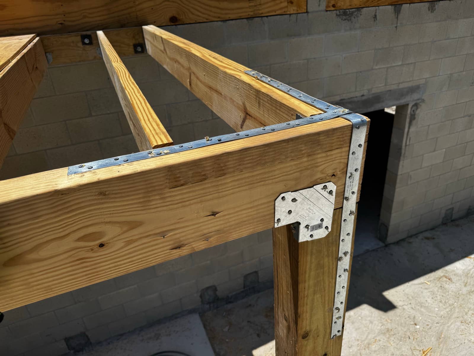 Porch beam detail, hurricane straps | framing work in North Port, FL by Sosnin Builders