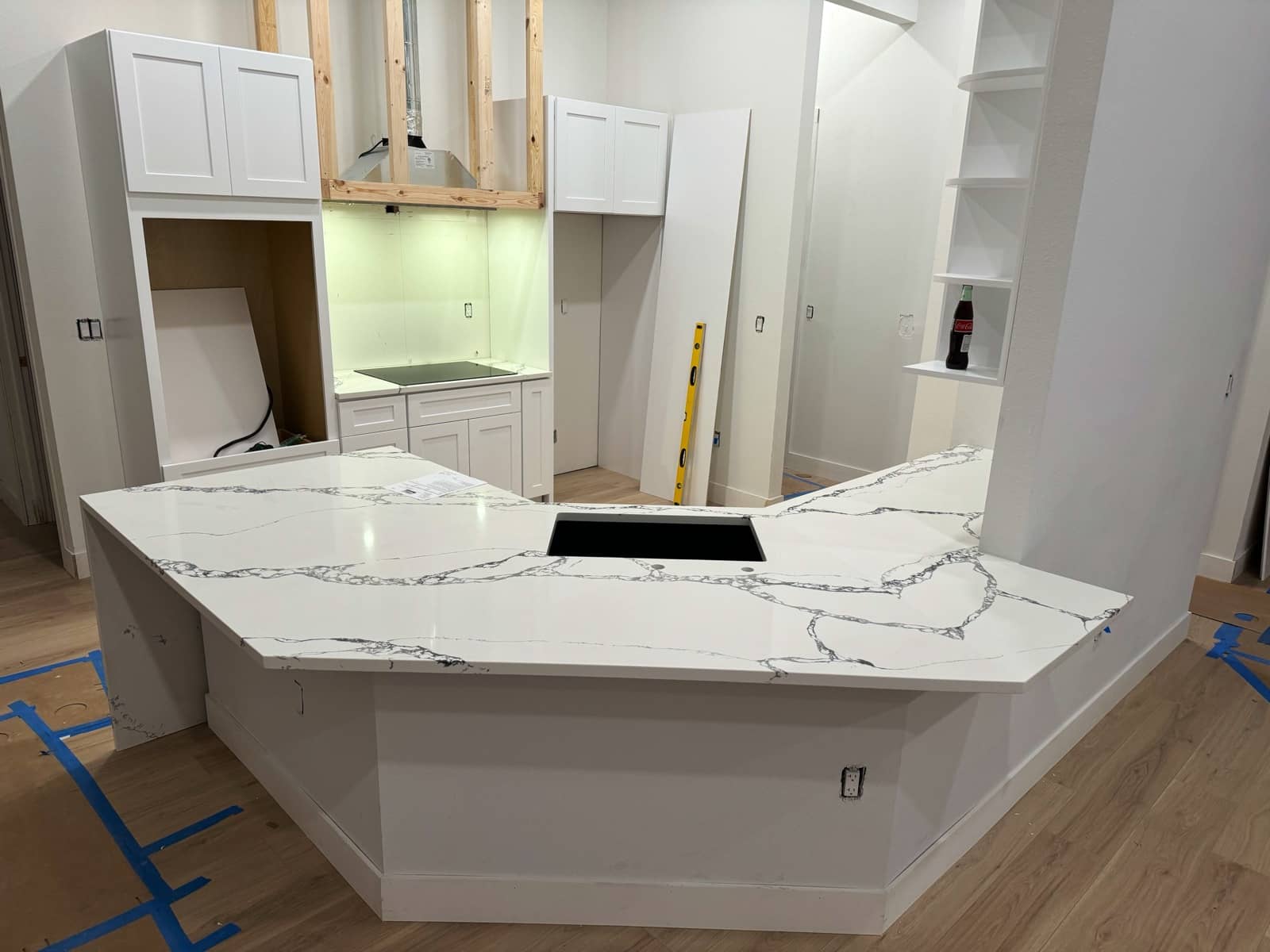 Quartz waterfall island countertop installed | new home construction in Port Charlotte, FL by Sosnin Builders