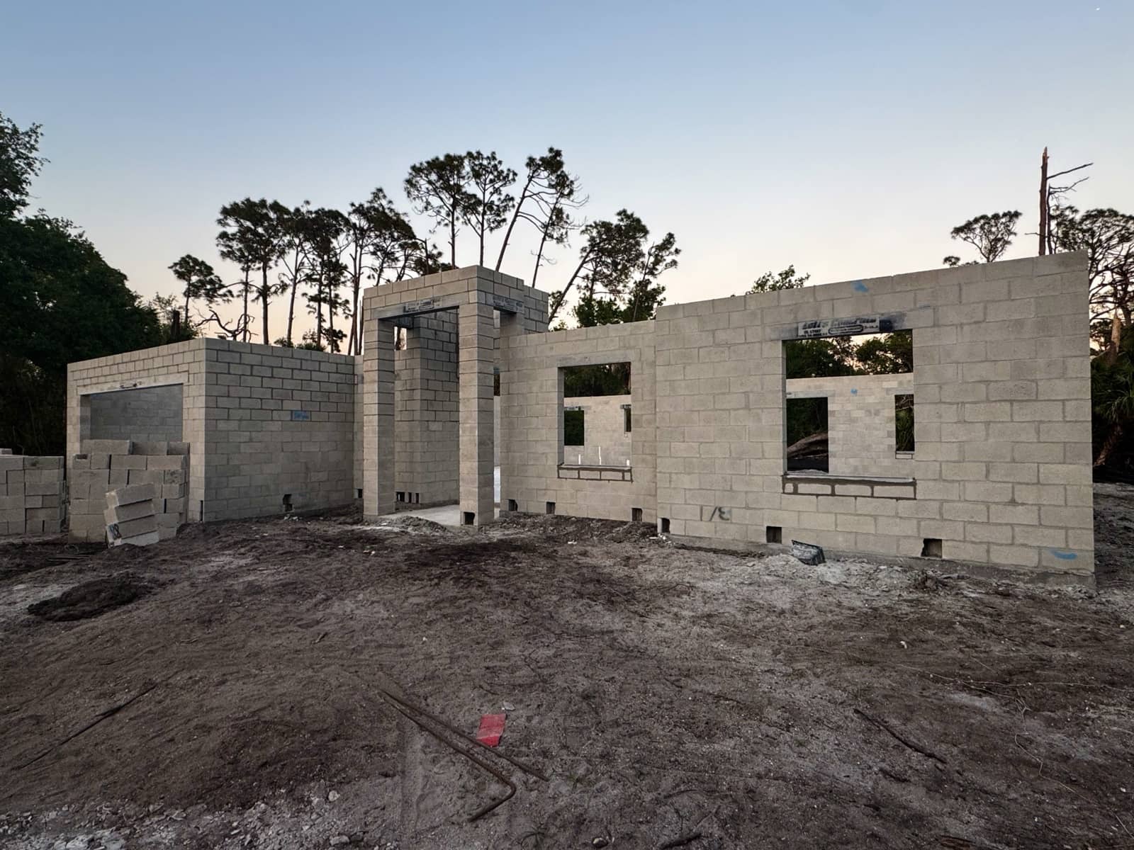 Block shell front elevation at dusk | new home construction in Port Charlotte, FL by Sosnin Builders