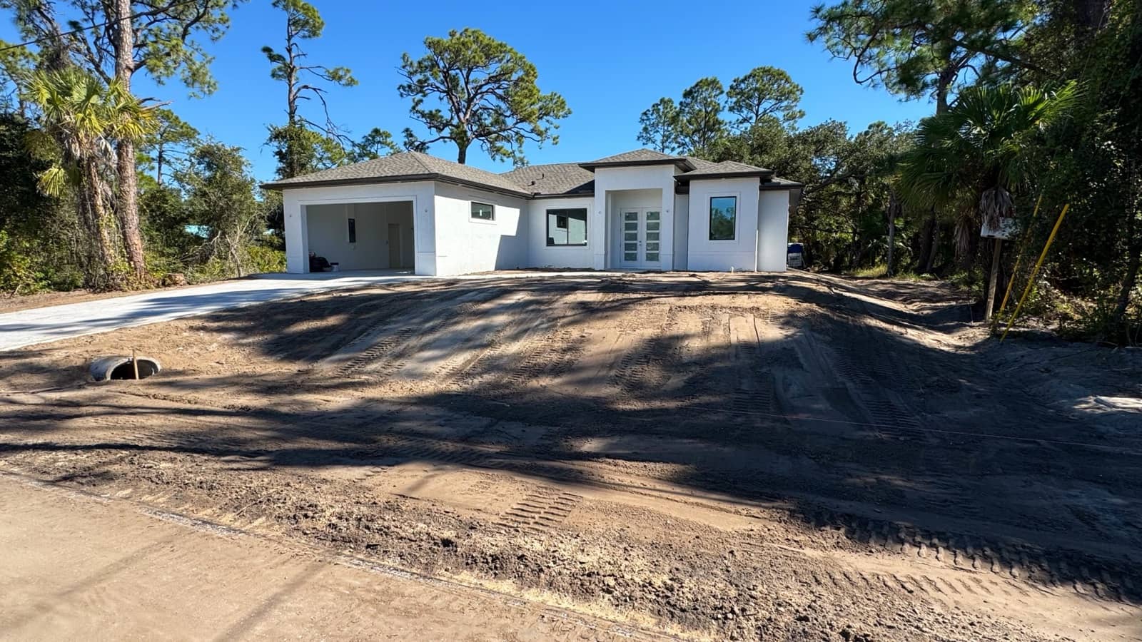 Completed home street view before landscaping | new home construction in Port Charlotte, FL by Sosnin Builders