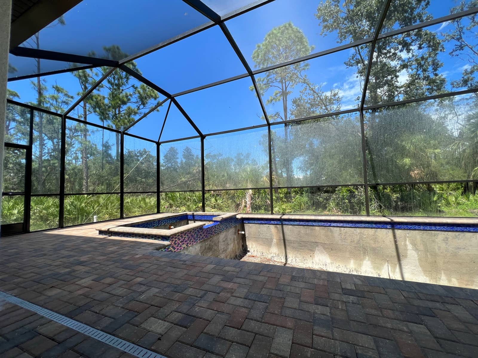 Screen enclosure over pool under construction | screen enclosure work in Port Charlotte, FL by Sosnin Builders